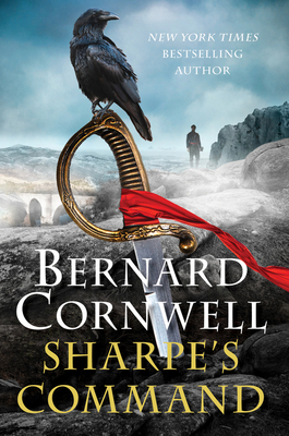 Book cover:  A black bird sitting on the hilt of a sword with red fabric tied to the handle and shape of man in background. Title: Sharpe's Command by Bernard Cornwell